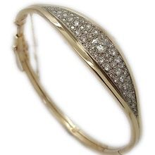 9ct yellow and white gold hinged bangle set with diamonds.
