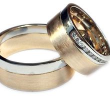 His and hers Platinum and rose gold rings with diamonds