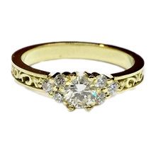 Detailed yellow gold diamond engagement ring