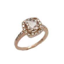 Halo style engagement ring set in 9ct rose gold with cushion cut morganite and  small round cut diamonds