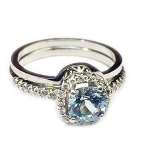 9ct white gold ring  set with blue topaz and diamonds