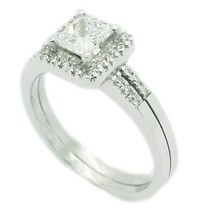 Platinum engagement ring  set with princess cut diamond and brilliant cut diamonds