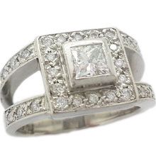 Princess cut diamond engagement ring  with brilliant cut diamonds in  18ct white gold