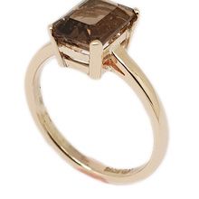 9ct yellow gold ring ,set with (8×6) emerald cut smokey topaz.
