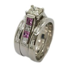 Contemporary style engagement and wedding rings in platinum set with  princess cut 0, 64ct diamond, and 4 princess cut diamonds weighing  0, 48ct in total and four princess cut pink sapphires  weiging 0,44ct in total