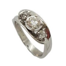 Beautifully elegant platinum engagement ring set with Brilliant Cut Diamond = 0, 51K VS2. and two old cut diamonds weighing 0, 25ct in total.
