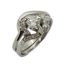 Platinum engagement and wedding ring
Engagement ring set with centre diamond weighing 0,44ct and 14 small diamonds weighing 0,33ct in total