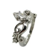 Platinum engagement ring in a crown style design with centre diamond marquise cut 0,50 I VS2, and 4 small brilliant cut diamonds weighing 0,19ct in total