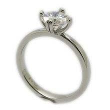 Platinum engagement ring set with original Charles & Colvard single moissanite 6,5mm.