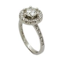 Platinum halo style engagement ring set with centre diamond 0,72 I SI2 and 28 × 0,01ct diamonds in a halo setting  and on the band.