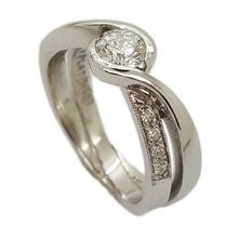 Platinum engagement ring set with centre diamond - 0, 45ct E VS1,and 8 × 0,05ct diamonds in the band.