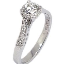 Platinum engagement ring set with 0,72H SI2 diamond, and 10 × 0,005ct diamonds in the shoulders. 