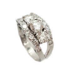 Dazzling platinum engagement wedding ring, set with centre diamond 0,40ct, 2× side diamonds 0,28  and  0,27ct and 14 diamonds in side bands totalling 0,50ct.
