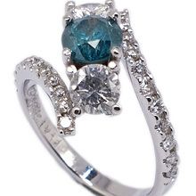 Platinum engagement ring set with blue and white diamonds